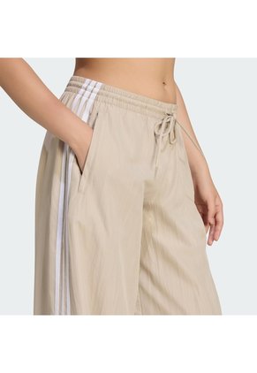 Pantalón Beige Adidas Firebird Adilenium Mujer
