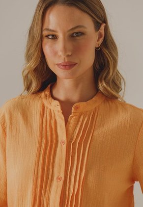 Blusa Naranja Arkitect Éxito