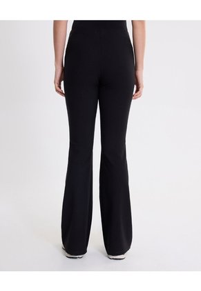 Pantalón Flare Tela Técnica Fluida Para Mujer  Deportiva  Color Negro Marca Atmos