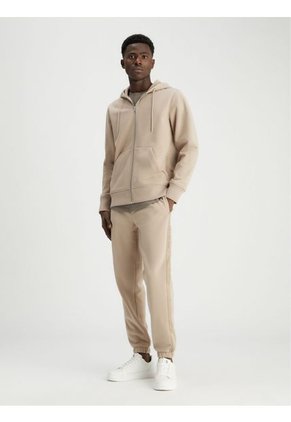 Jogger Beige Deportivo Con Logo Y Cinta Calvin Klein