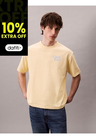 Camiseta Amarilla Holgada Con Logo Gráfico Con Letras Calvin Klein Calvin Klein