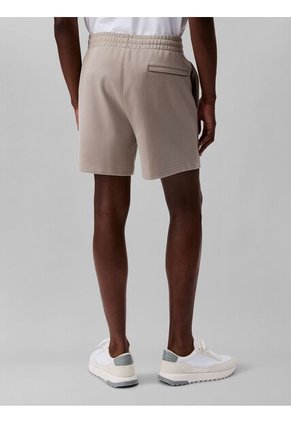 Pantaloneta Beige De Punto De Canalé Con Monograma Bordado Calvin Klein
