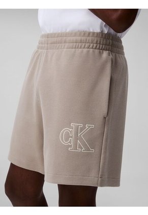 Pantaloneta Beige De Punto De Canalé Con Monograma Bordado Calvin Klein