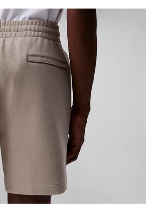 Pantaloneta Beige De Punto De Canalé Con Monograma Bordado Calvin Klein