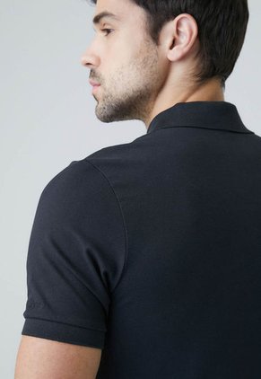 Polo CHEVIGNON Negro
