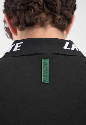 Polo Negro-Blanco LACOSTE Movement