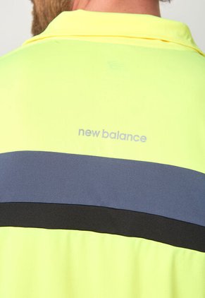 Buzo new balance Accelerate Amarillo Neón