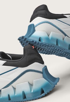 Tenis Running Blanco-Azul Petróleo-Coral Reebok Zig Dynamica 4