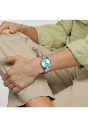 Relojes Swatch Unisex THE GLOW OF IRONY. Acero Inoxidable Plateado SYXS155G