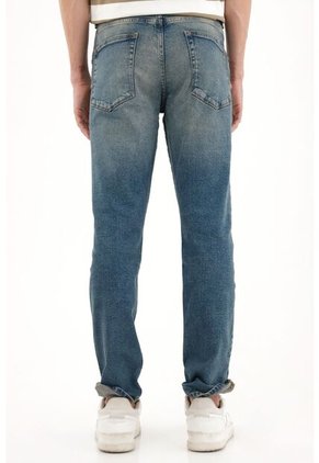 Tennis Jean Skinny Tiro Medio Azul Con Acabado Ligero Para Hombre