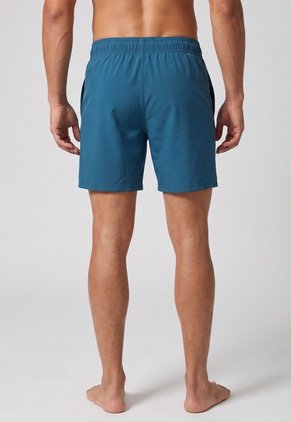 Pantaloneta Training UNDER ARMOUR Woven Wordmark Azul