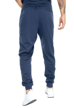 Pantalón Azul UNDER ARMOUR SPORTSTYLE TRICOT